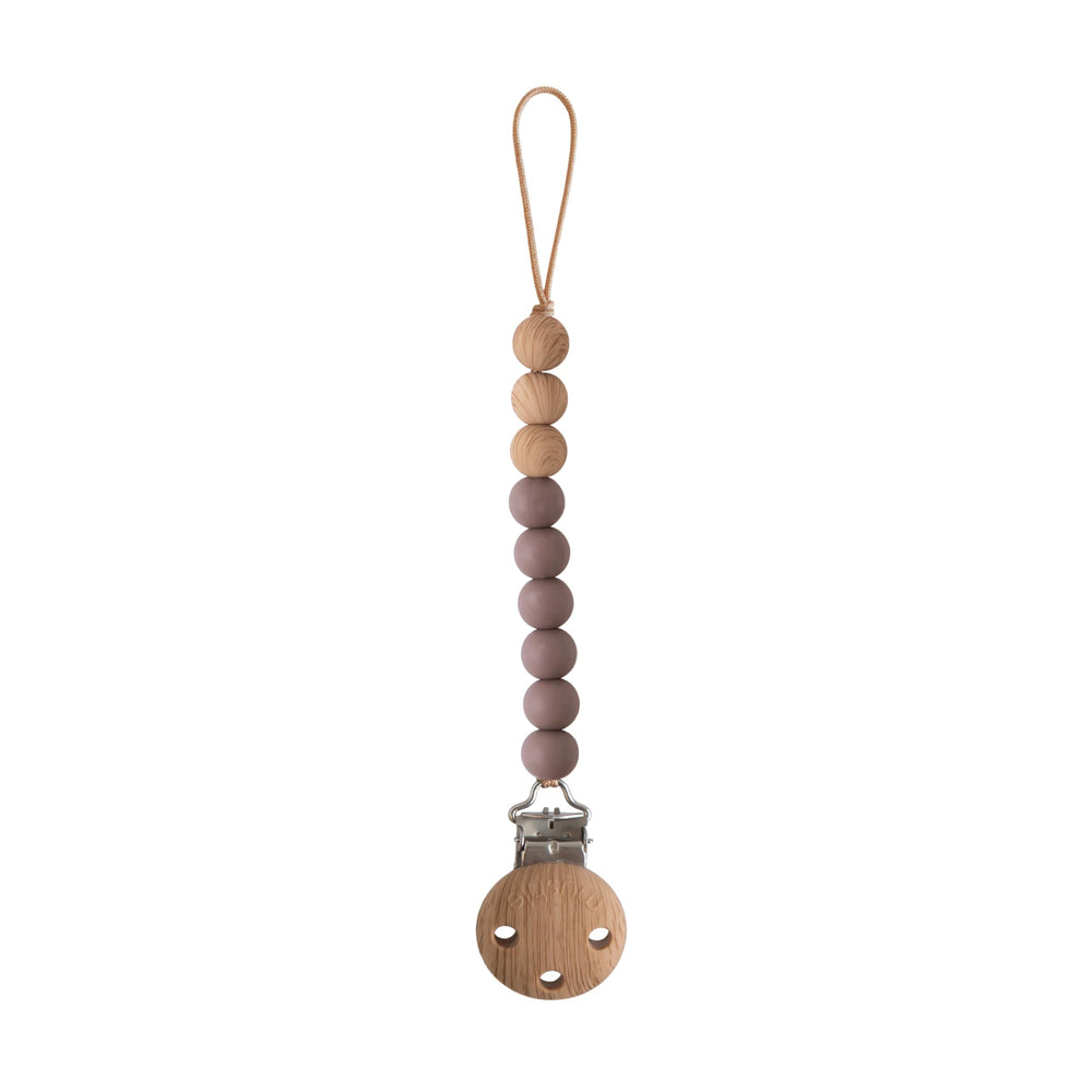 Mushie Eva pacifier clip closure with secure silicone clasp for on-the-go safety.