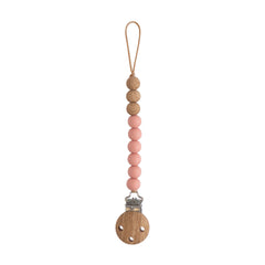 Mushie Eva pacifier clip in powder keeps pacifiers within reach for busy families.