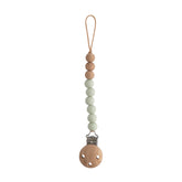 Mushie Eva Sage pacifier clip closeup with silicone beads for mess-free access