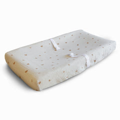 Mushie Rainbows muslin cover folded, showcasing soft, breathable comfort for baby.
