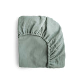 Mushie extra-soft muslin fitted MINI crib sheet on mattress for breathable comfort