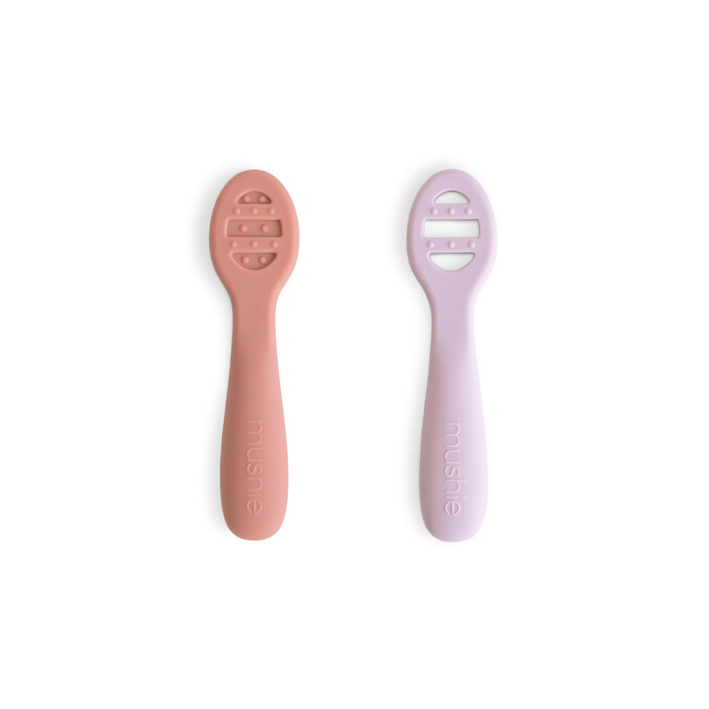 Mushie first-feeding spoons stage 1 solid surface for thin purees.