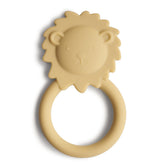 Mushie Lion teether front view showing soft silicone bite area for soothing gums.