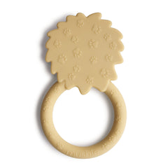 Mushie Lion teether side view highlighting ergonomic handle for tiny hands.