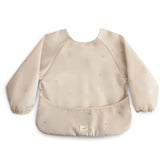 Mushie long sleeve bib sun water-resistant fabric keeps outfits clean during meals