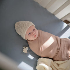 Mushie mini crib sheet Tradewinds on a rectangle mattress for proper sizing