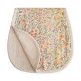 Mushie muslin burp cloth in pastel blooms close-up shows soft organic cotton texture.