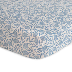 Mushie muslin crib sheet with elastic edges for a snug, easy-fit.