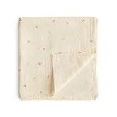 Mushie muslin swaddle blanket cherries pattern with ultra-soft organic cotton for newborn comfort