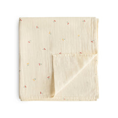 Mushie muslin swaddle blanket cherries pattern with ultra-soft organic cotton for newborn comfort