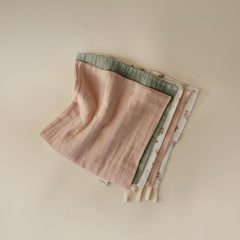 Mushie pink flowers washcloths offer soft skin care.