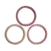 Mushie Pearl Teether Bracelet in Linen color, gentle silicone for soothing gums.