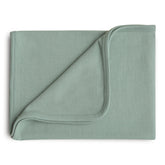 Mushie ribbed baby blanket closeup in roman green showing soft organic cotton texture