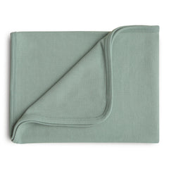 Mushie ribbed baby blanket closeup in roman green showing soft organic cotton texture