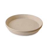 Mushie round dinnerware vanilla plate for kids, durable and dishwasher-safe.
