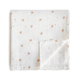 Mushie Sparrow muslin swaddle blanket with soft, breathable fabric for peaceful baby naps.