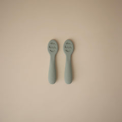 Stage 1 solid-surface Mushie spoon helps thin purees and yogurts easily.