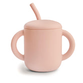 Mushie training cup with lid, blush color, helping prevent spills during meals.