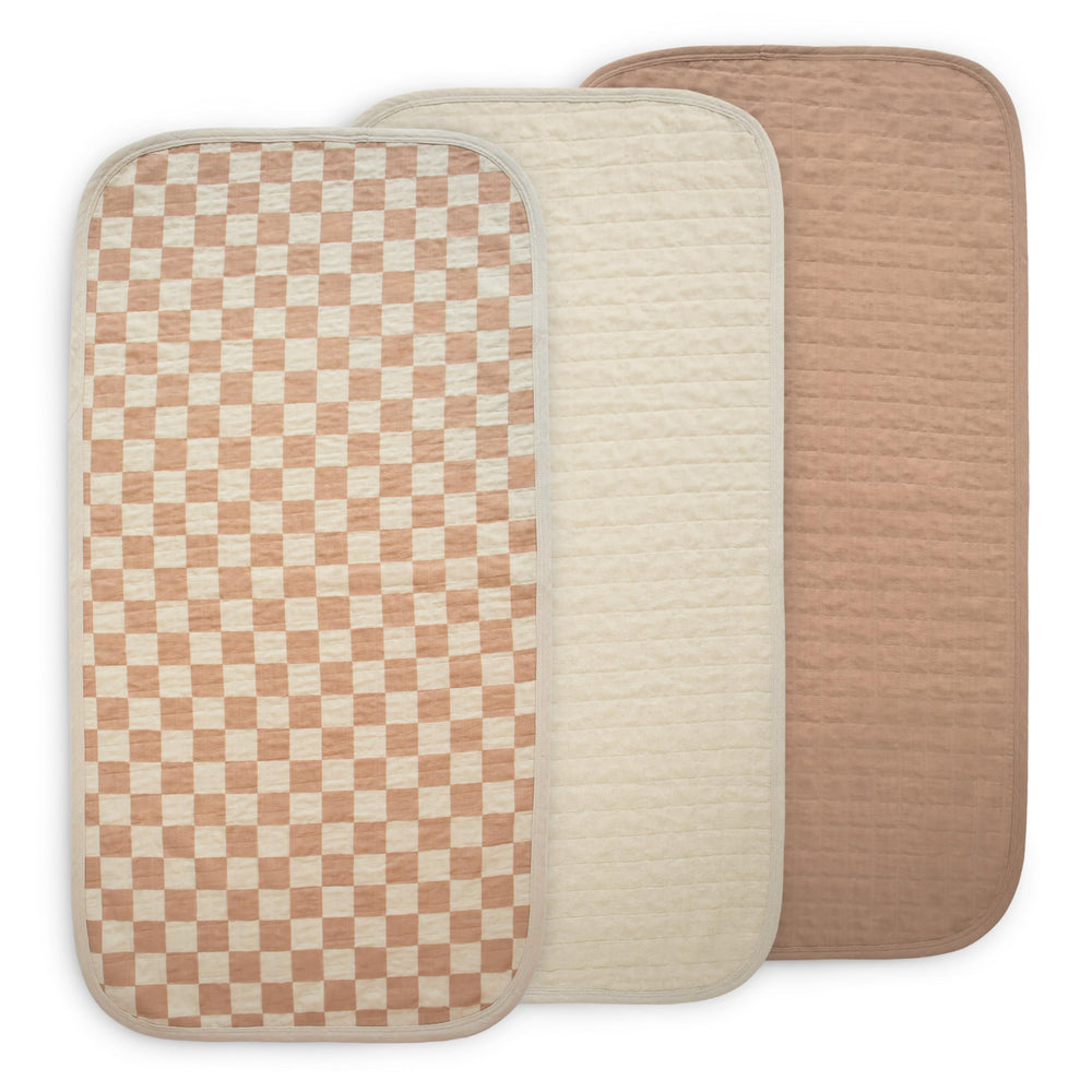 Mushie waterproof changing pad liner natural check set, keeps diaper changes cleaner.