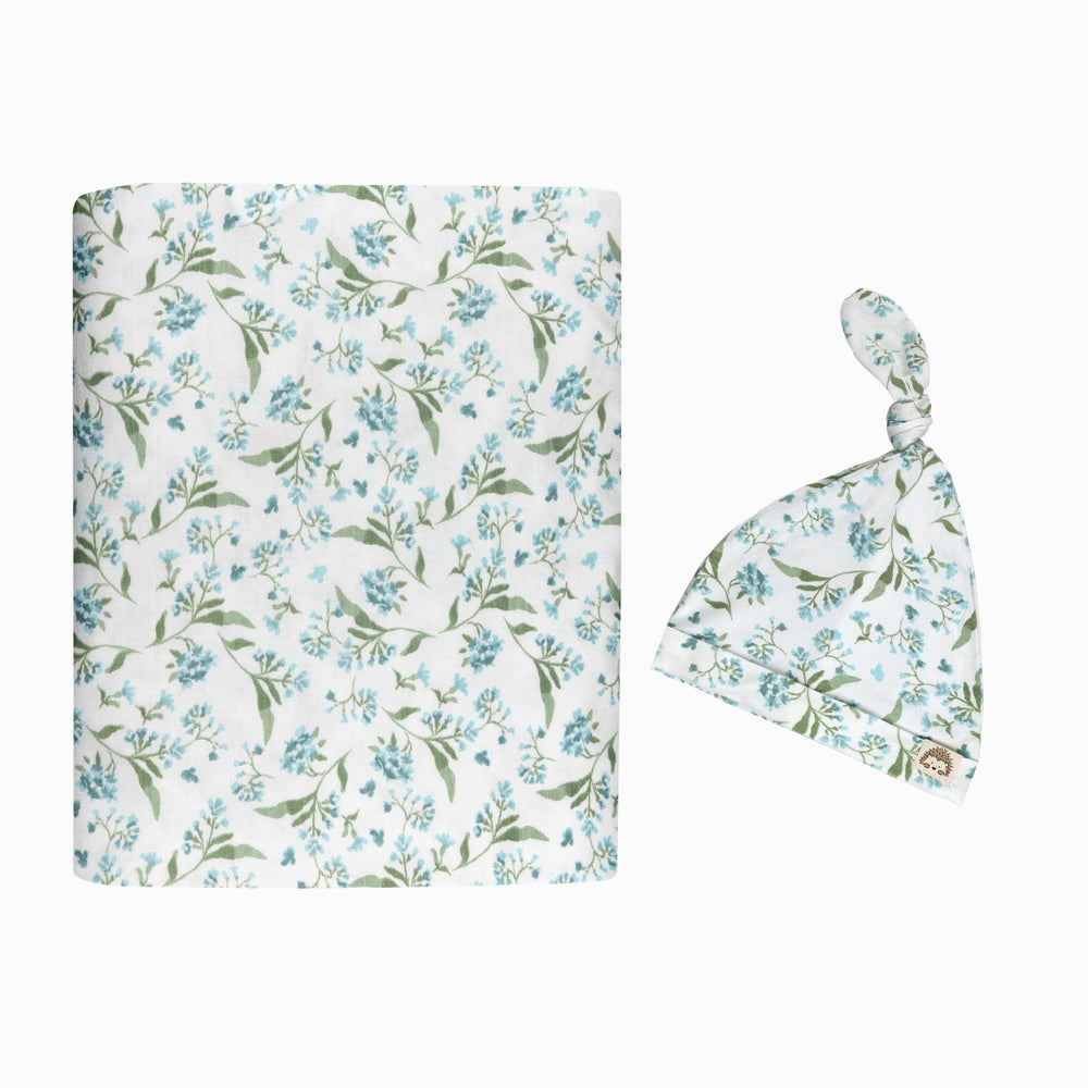 MY LITTLE ZONE botanical blue swaddle blanket offers soft, stretchy comfort for newborns.