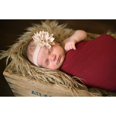 My Lello baby petal headband in apple green adds color to outfits.
