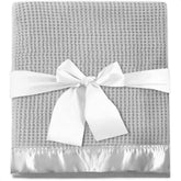 NADOBA thermal waffle baby blanket texture closeup shows warm breathable fabric for cozy nights