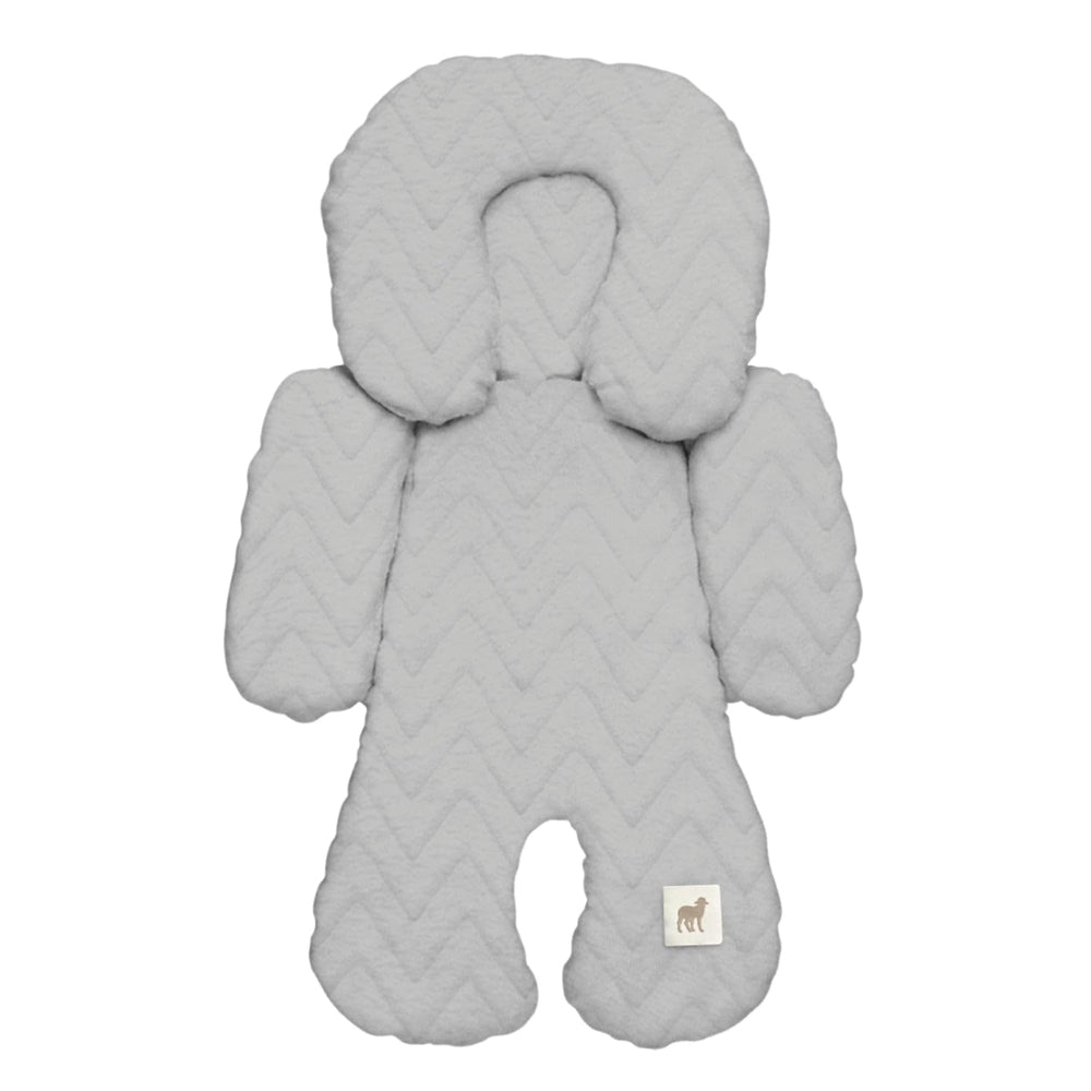 NAP baby car seat insert with head and body support in zigzag gray, keeps newborn comfortable and secure.