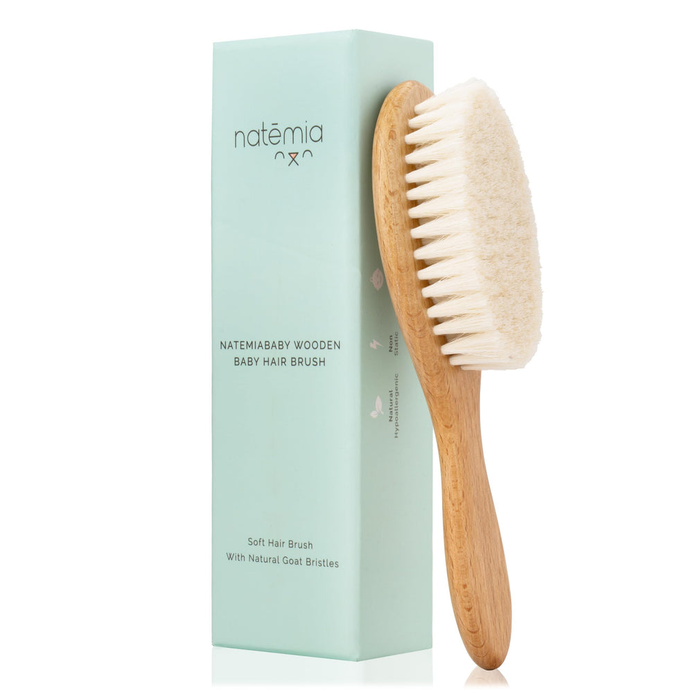 Natemia wooden baby hair brush with soft goat bristles for gentle scalp care.