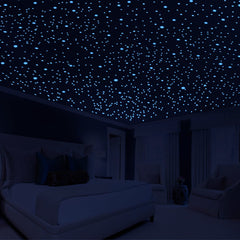 Neasyth glow stars green ceiling dots illuminate a cozy kids' room at night.