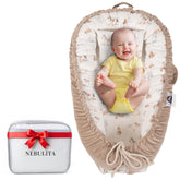 Nebulita newborn lounger cream with folded base enabling gentle supervised feeding.