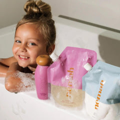 Nemah bottle demonstrates tear-free pour for gentle cleansing.