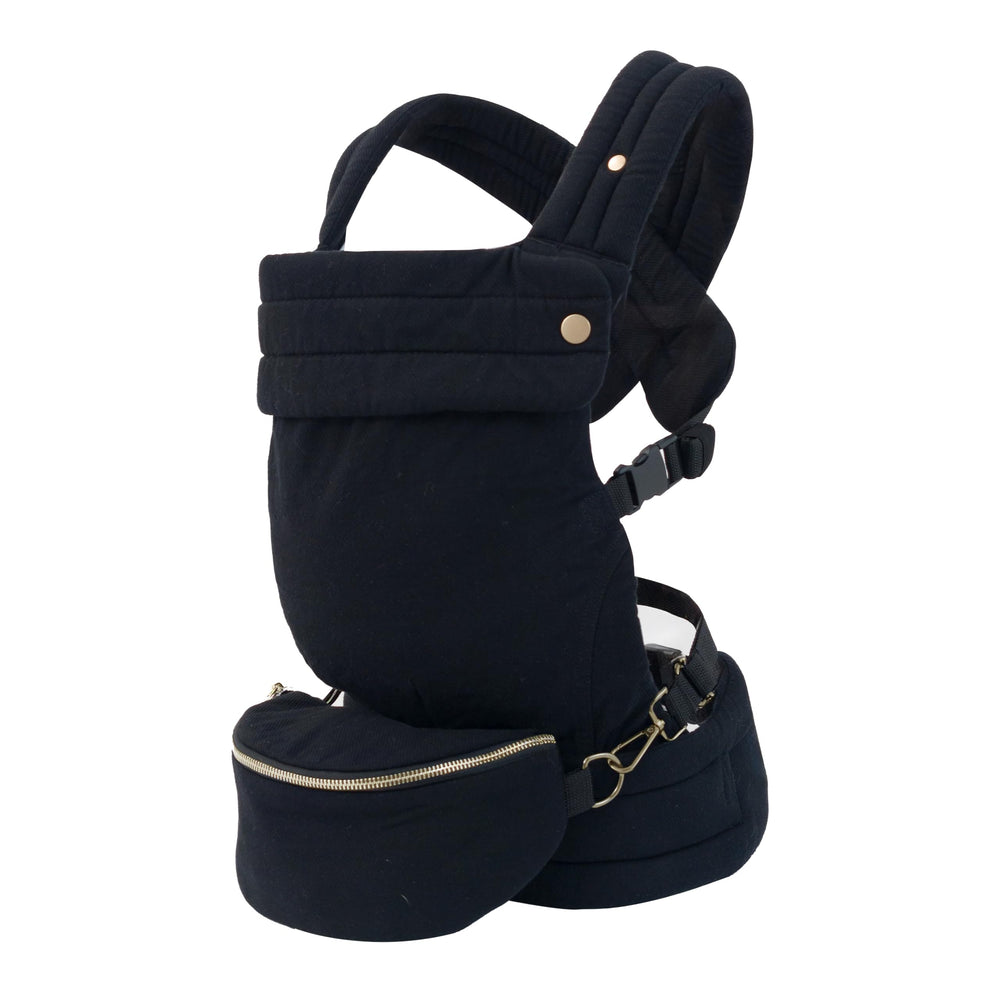 Nest Blanche ergonomic baby carrier demonstrates the M-position for hip-friendly support.