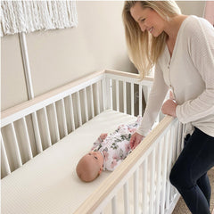 Newton Baby Essential removable cover ready for machine washing between uses.