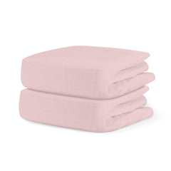 Newton Baby fitted crib sheet two-pack in pink promotes comfort and airflow.