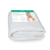 Newton Baby waterproof crib mattress pad showing protective waterproof layer for clean sleeping surfaces.