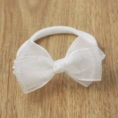 Nihao Baby gift-pack headbands in white gauze bag, ready for gifting