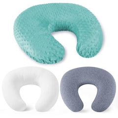 NiSleep nursing pillow with light green cover supports comfortable breastfeeding sessions.