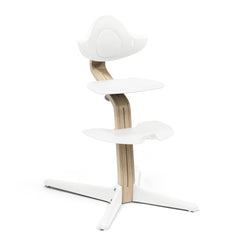 Nomi chair by Stokke, setup angle view shows easy family table seating