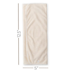 Nora's Nursery prefold inserts snapped to a cover to demonstrate quick attachment.