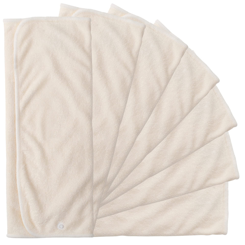 Nora's Nursery seven-pack prefold inserts laid flat show versatile 13x15 size for diaper fit.