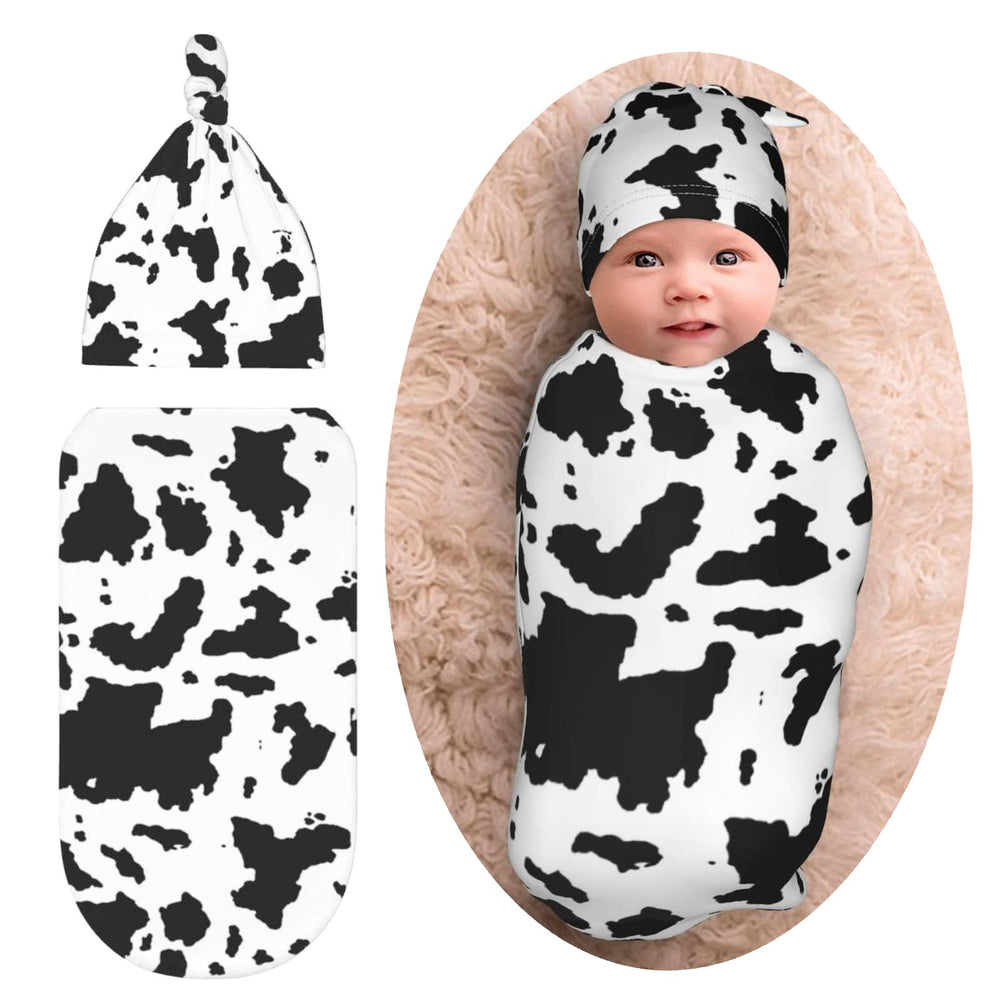 Norchzi cow print swaddle with hat set keeps baby snug and secure.