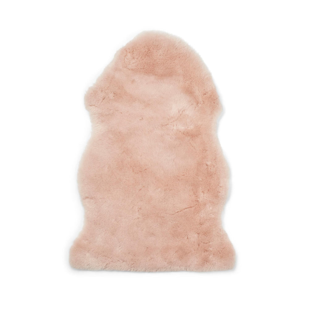 Nordic Sheep pink baby lambskin in a pram offers cozy, temperature-regulating comfort.
