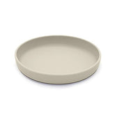 noüka flat plate with lip edge aiding easy self-feeding for toddlers.