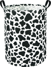 NTAOHAMPER Cow Laundry Basket with sturdy handles for easy transport and room decor.