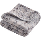 NTBAY 4-layer muslin blanket shows soft, breathable fabric for newborn comfort.