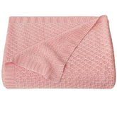 NTBAY cable-knit cooling blanket pink draped in crib for breathable comfort.