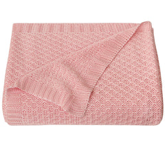 NTBAY cable-knit cooling blanket pink draped in crib for breathable comfort.