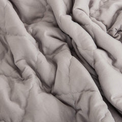 NTBAY comforter in smoke grey color complements modern nurseries.