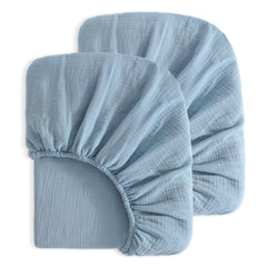 NTBAY mini crib sheets in sky blue provide a soft, breathable surface for naps.