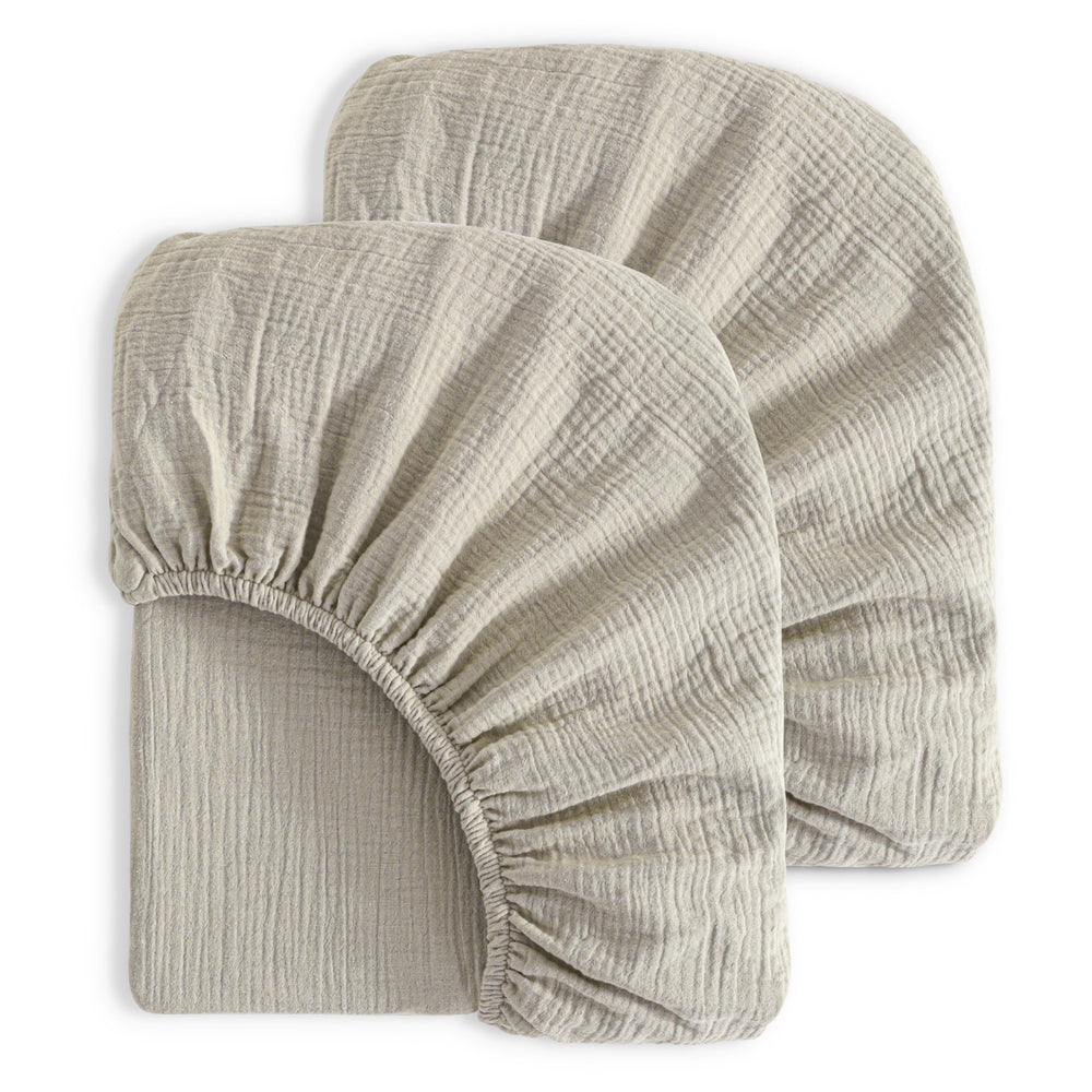 NTBAY muslin crib sheets folded view, soft breathable fabric for cozy naps